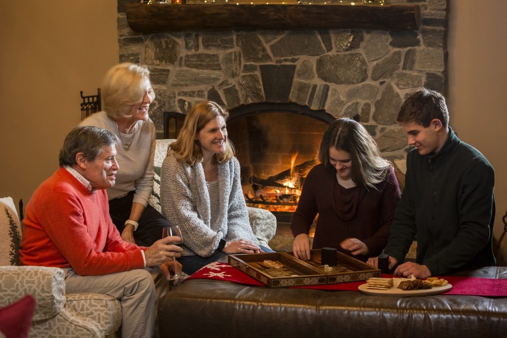 family playing games in seesaws lodge