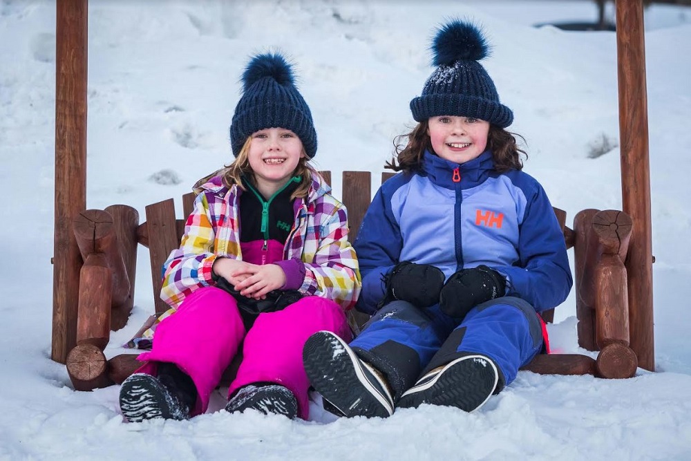 girls on swing in winter